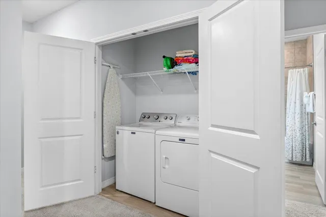 a bathroom with a double vanity sink mirror and toilet