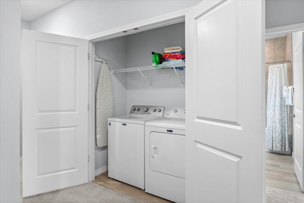 14241 Beach Heather Court Perdido Key, FL 32507 - Photo 26 of 39 a view of storage and utility room with washer and dryer