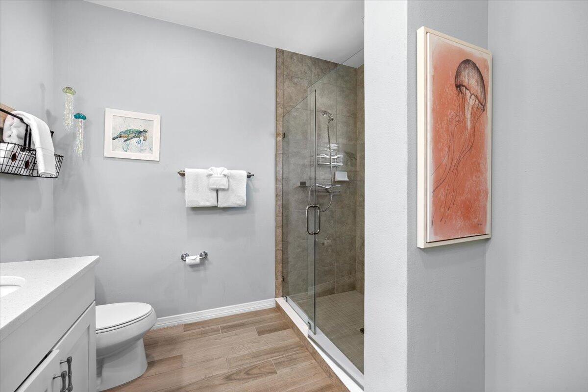 14241 Beach Heather Court Perdido Key, FL 32507 - Photo 29 of 39 a bathroom with a shower a toilet and sink