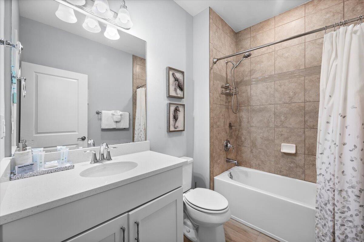 14241 Beach Heather Court Perdido Key, FL 32507 - Photo 31 of 39 a bathroom with a sink a toilet and a bathtub