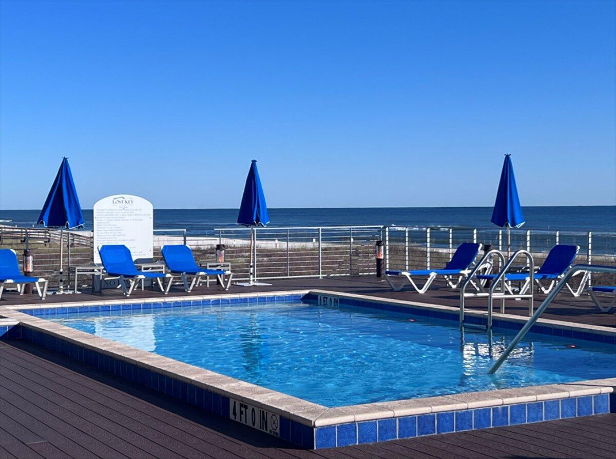 14241 Beach Heather Court Perdido Key, FL 32507 - Photo 34 of 39 a view of a living room and dining room
