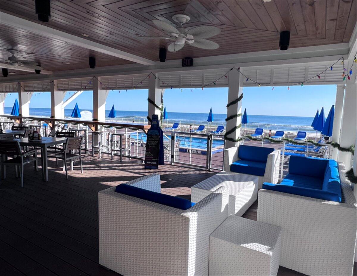 14241 Beach Heather Court Perdido Key, FL 32507 - Photo 35 of 39 a kitchen with a table chairs and a wooden floor