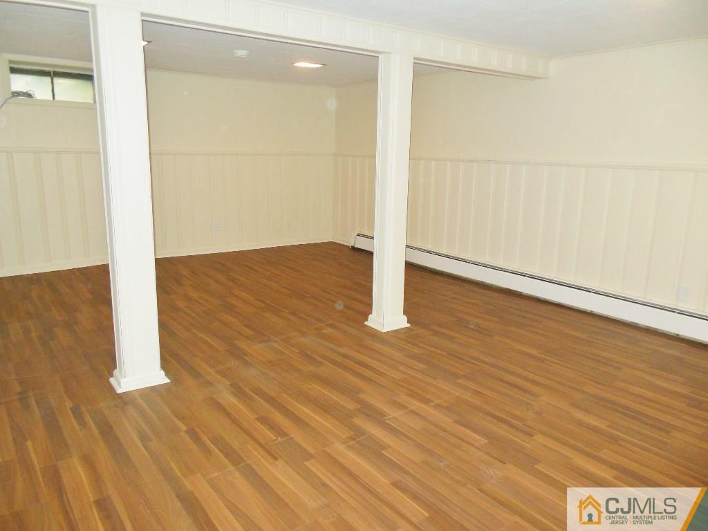 514 Fairway Road Linden, NJ 07036 - Photo 12 of 16 a view of an empty room with wooden floor