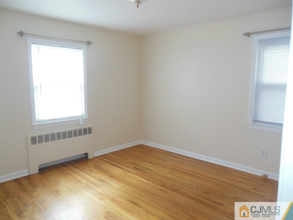 514 Fairway Road Linden, NJ 07036 - Photo 8 of 16 an empty room with a window