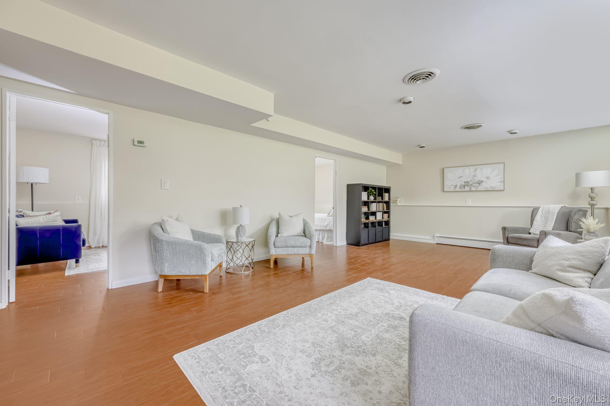 12 Woodwind Lane Spring Valley, NY 10977 - Photo 16 of 27 a living room with furniture and a table