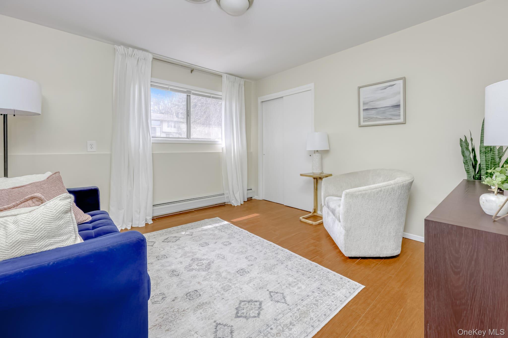 12 Woodwind Lane Spring Valley, NY 10977 - Photo 18 of 27 a bedroom with a bed and hallway