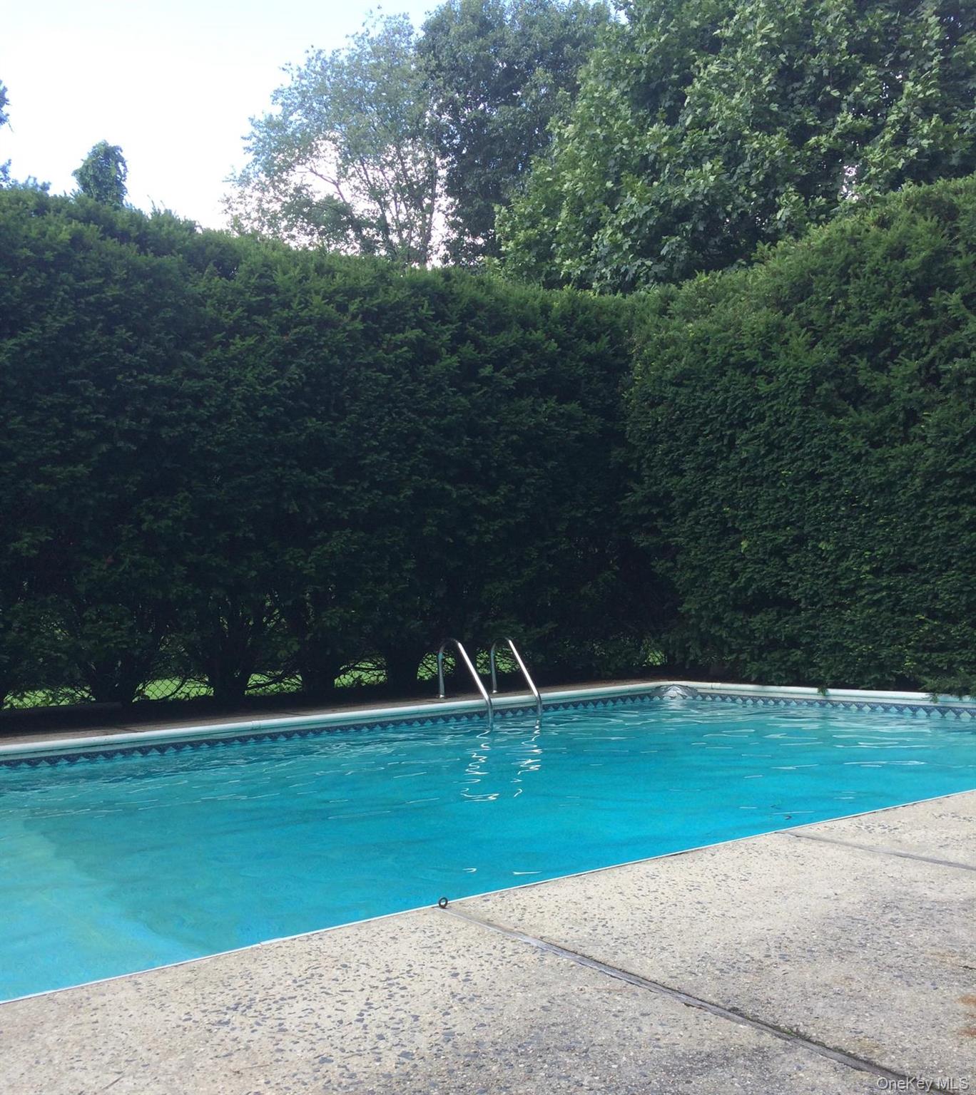 12 Woodwind Lane Spring Valley, NY 10977 - Photo 22 of 27 a view of a golf course with a lake