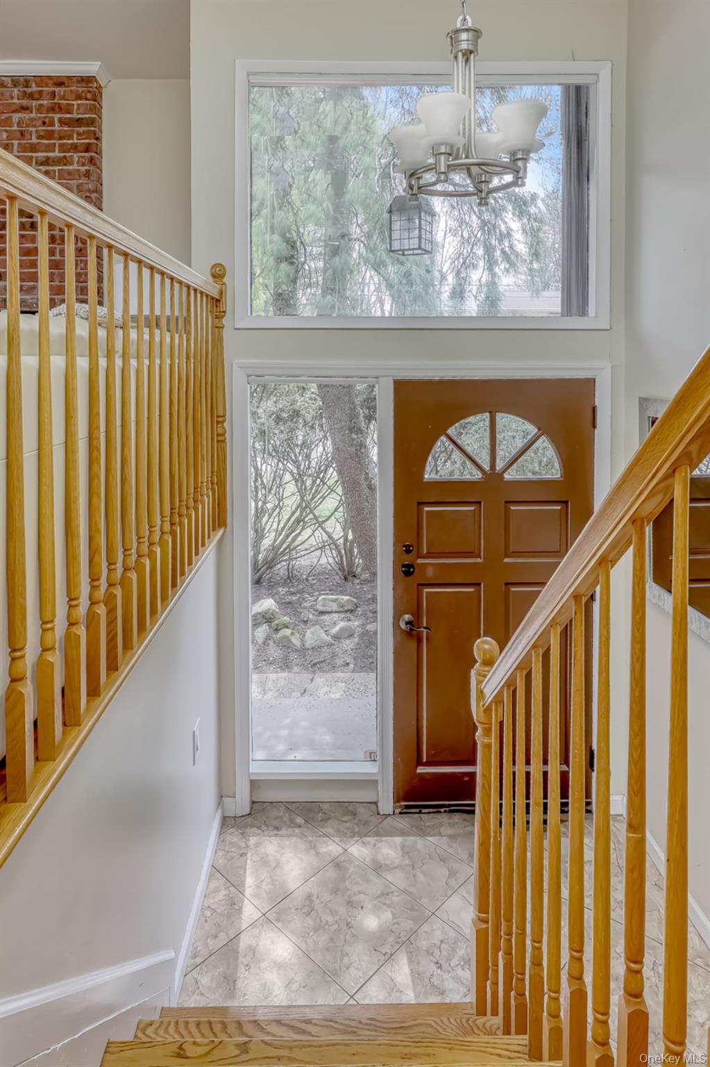 12 Woodwind Lane Spring Valley, NY 10977 - Photo 3 of 27 a view of entryway with wooden floor and stairs