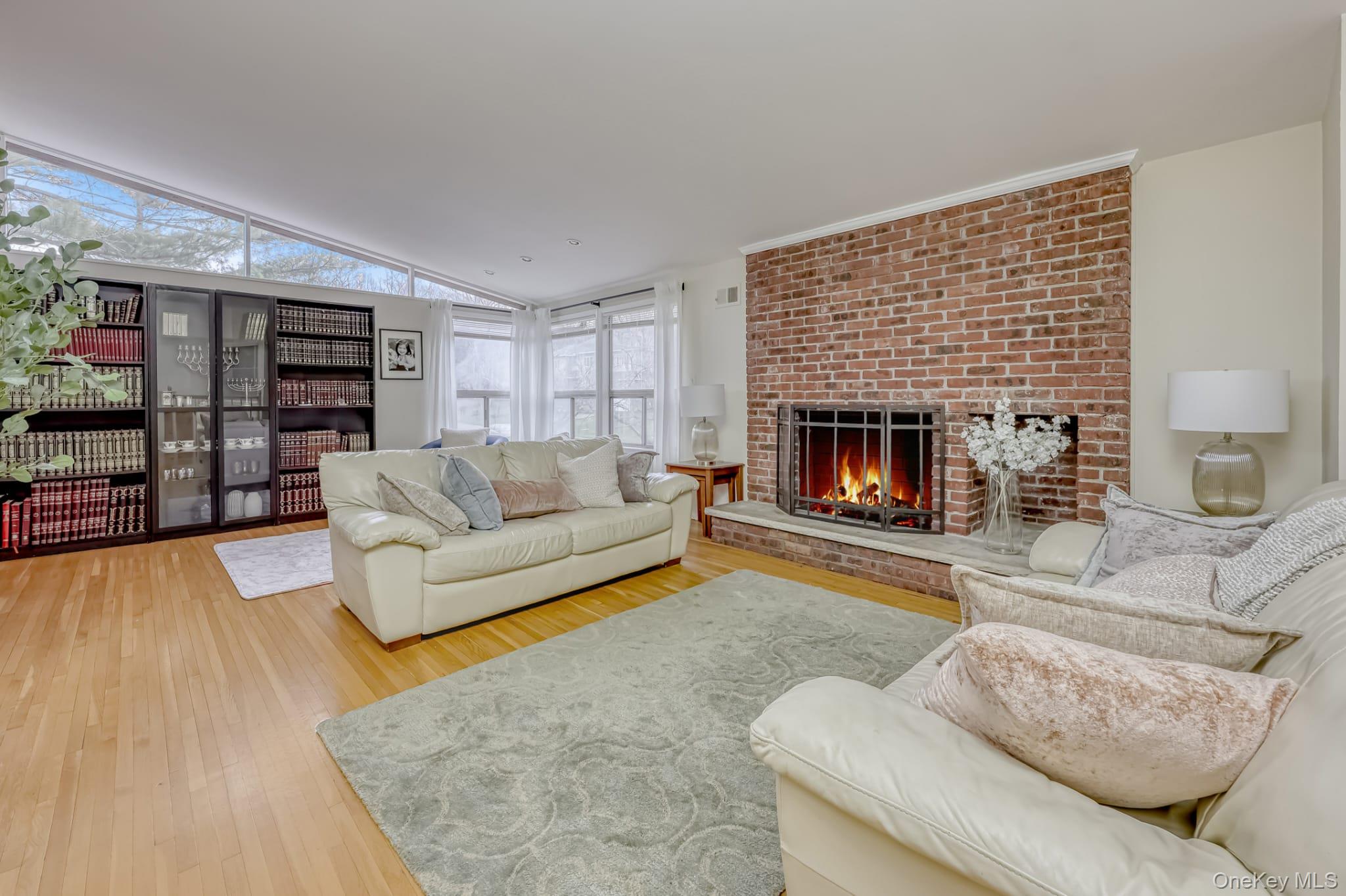 12 Woodwind Lane Spring Valley, NY 10977 - Photo 5 of 27 a living room with furniture and a fireplace