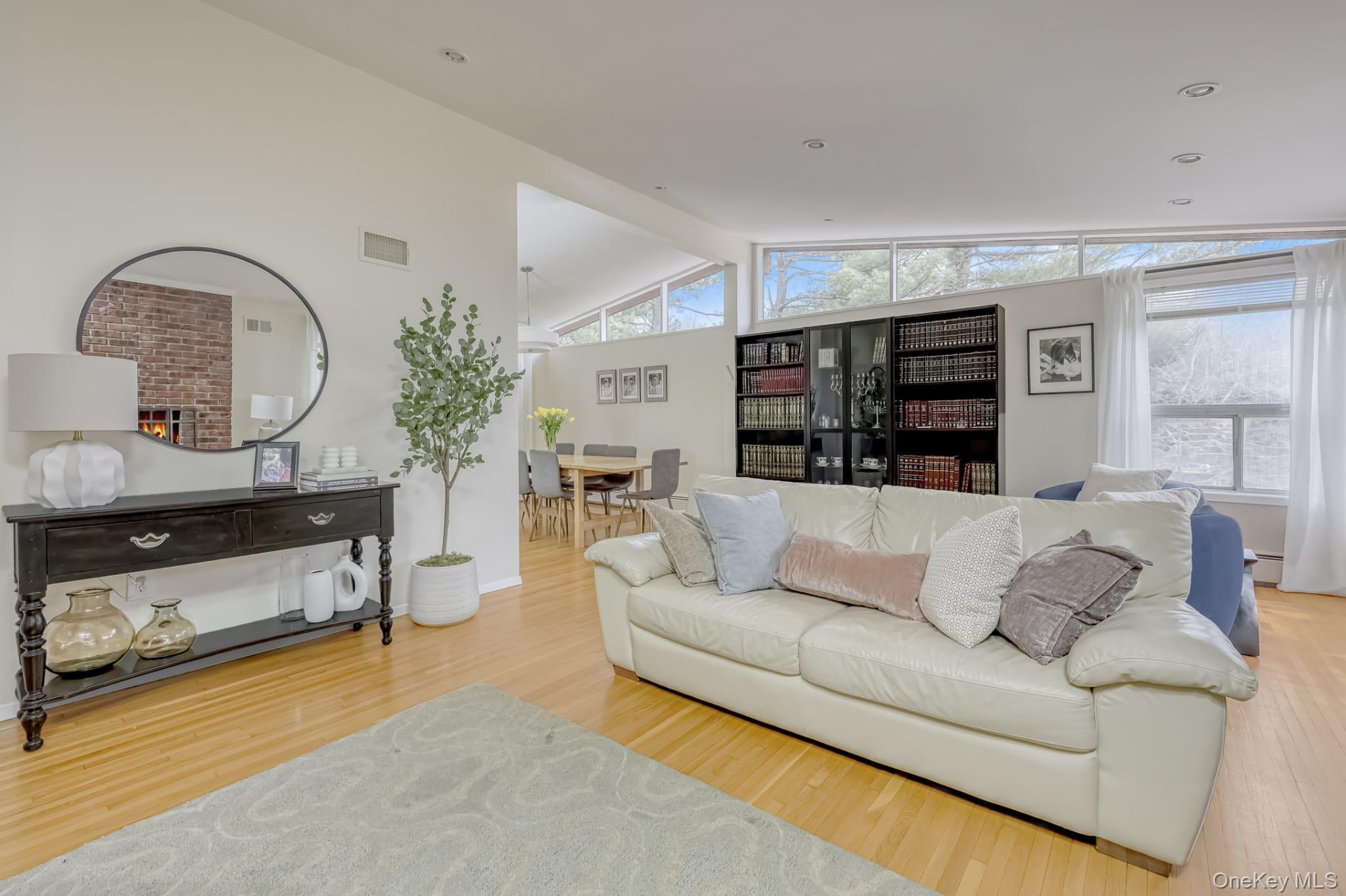 12 Woodwind Lane Spring Valley, NY 10977 - Photo 6 of 27 a living room with furniture and a fireplace