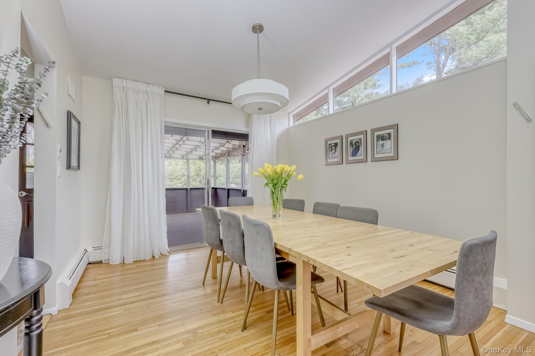 12 Woodwind Lane Spring Valley, NY 10977 - Photo 9 of 27 a view of a dining room with furniture window and wooden floor