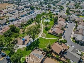 an aerial view of a house with a yard
