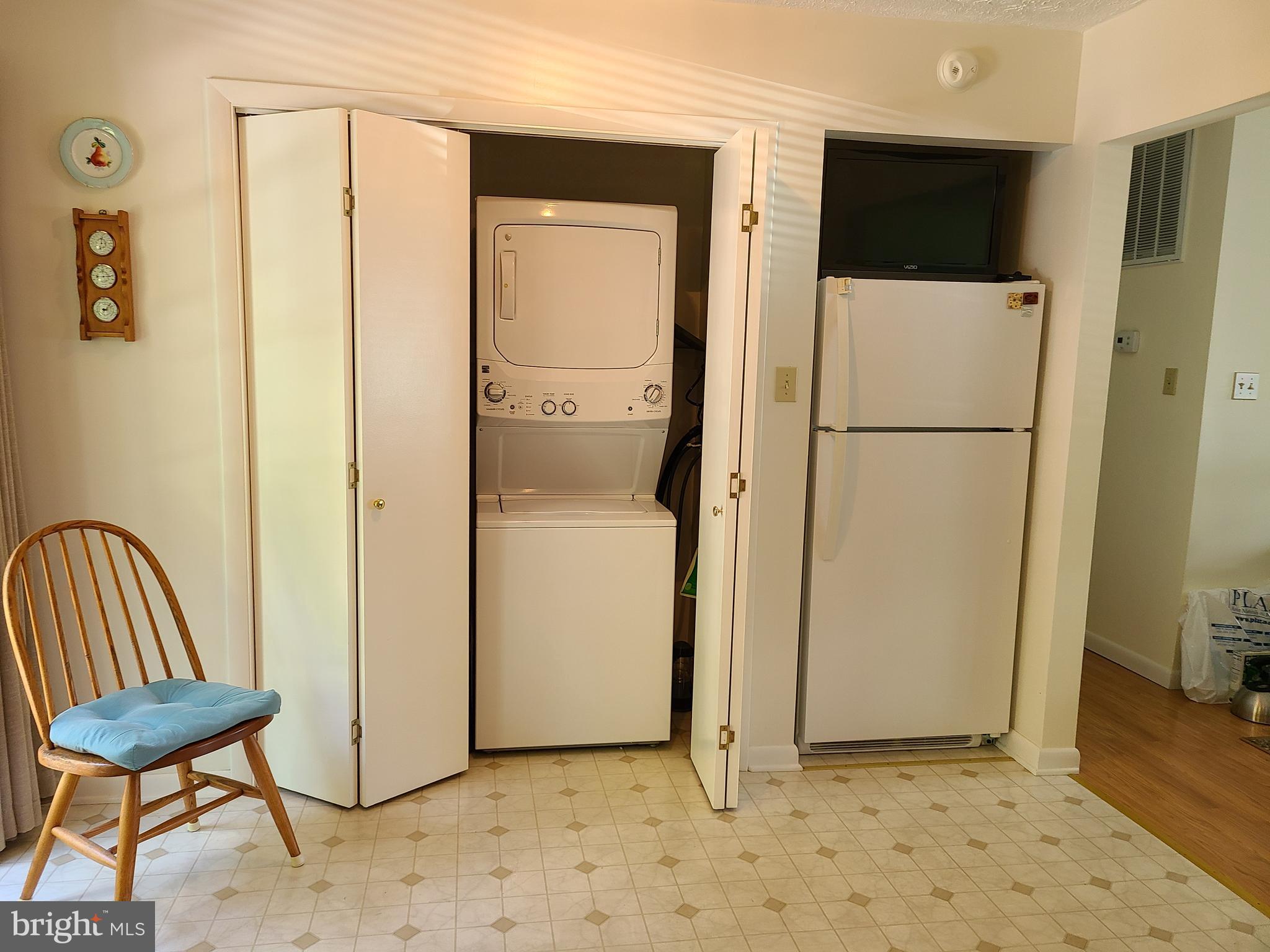 111 Valley Branch Drive Ranson, WV 25438 - Photo 20 of 26 Laundry closet and refrigerator in kitchen.