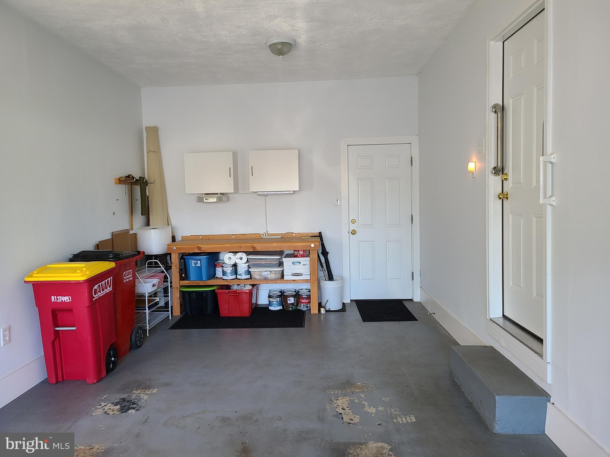 111 Valley Branch Drive Ranson, WV 25438 - Photo 21 of 26 One-car garage opens off kitchen w/door to backyar