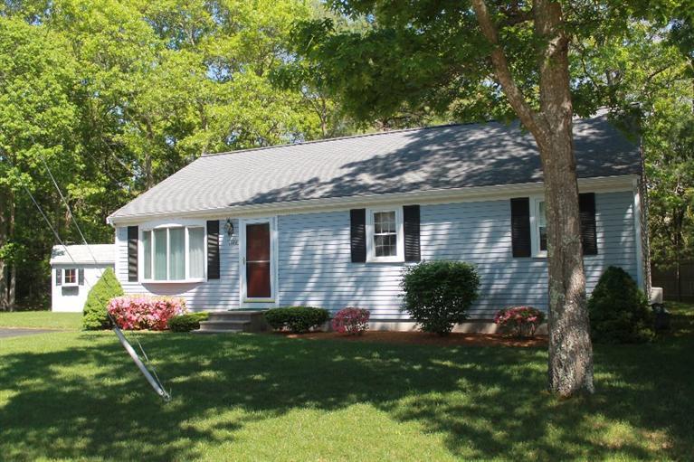 1344 Shootflying Hill Road Centerville, MA 02632 - Photo 1 of 18 a front view of house with yard and green space