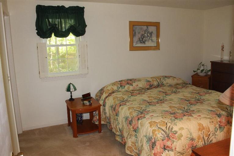 1344 Shootflying Hill Road Centerville, MA 02632 - Photo 11 of 18 a bedroom with a bed and a window