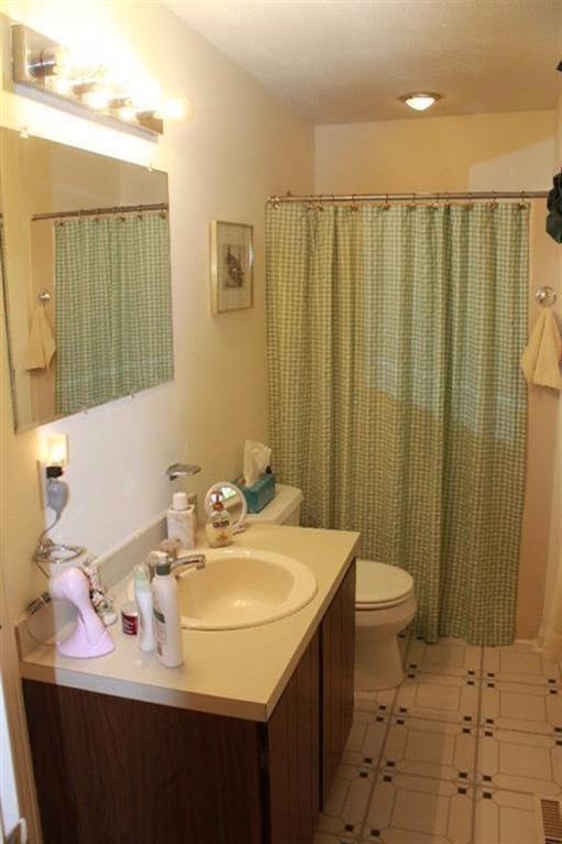 1344 Shootflying Hill Road Centerville, MA 02632 - Photo 12 of 18 a bathroom with a sink toilet and shower