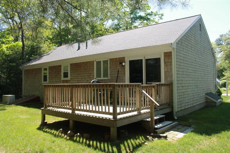 1344 Shootflying Hill Road Centerville, MA 02632 - Photo 16 of 18 a view of a house with a roof deck