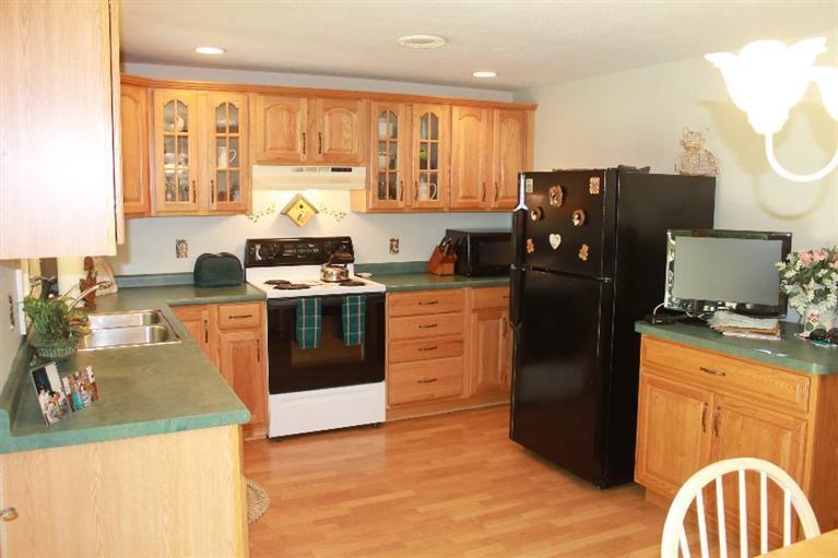 1344 Shootflying Hill Road Centerville, MA 02632 - Photo 3 of 18 a kitchen with a stove a refrigerator and a sink