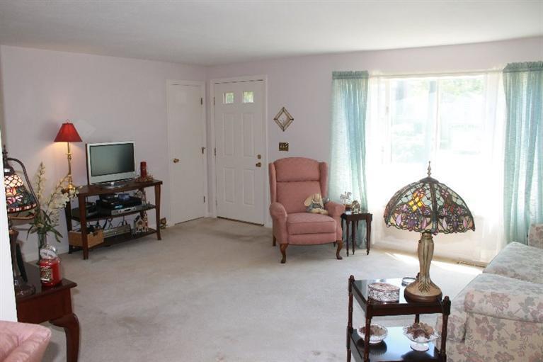 1344 Shootflying Hill Road Centerville, MA 02632 - Photo 6 of 18 a living room with furniture a rug and a window