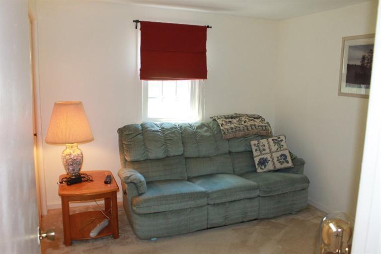 1344 Shootflying Hill Road Centerville, MA 02632 - Photo 9 of 18 a living room with furniture and a window