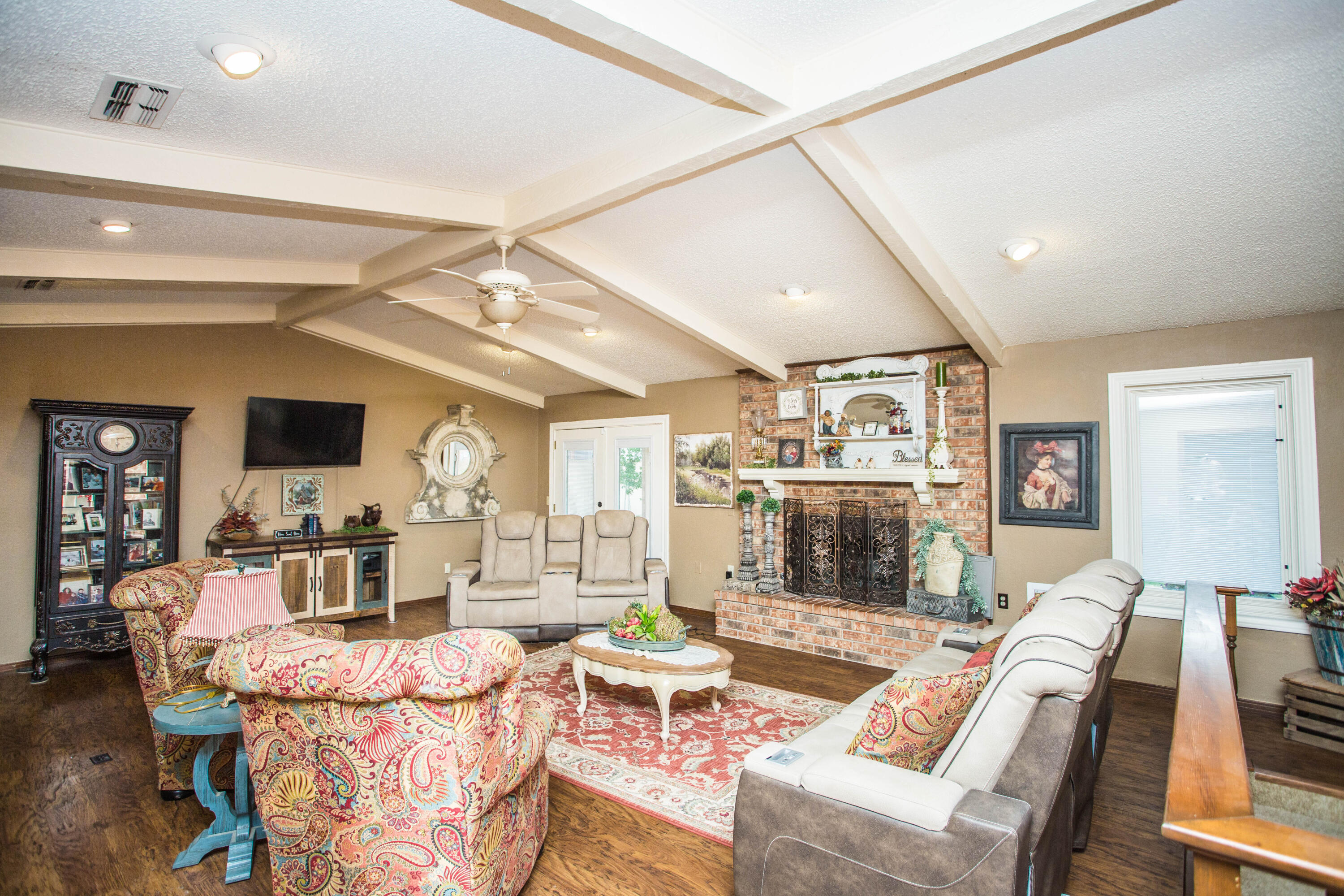 1304 Jefferson Drive Plainview, TX 79072 - Photo 11 of 50 a living room with fireplace furniture and a wooden floor