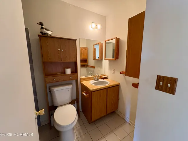 a bathroom with a toilet and bathtub