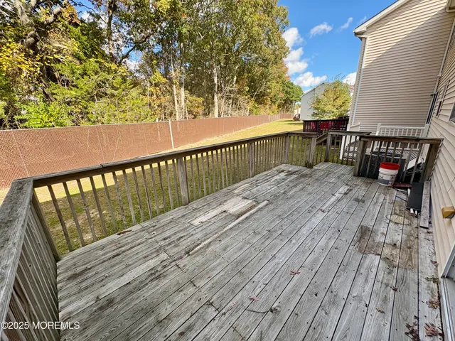 a balcony with wooden floor