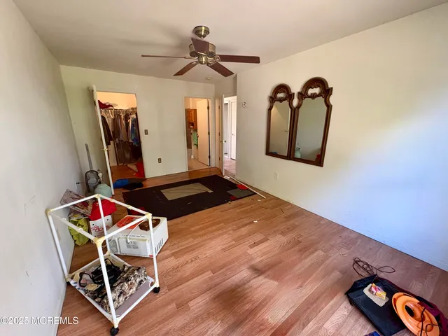 a living room with a bed furniture and decor