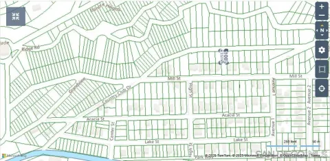 en suite bathroom with a window and wooden floor