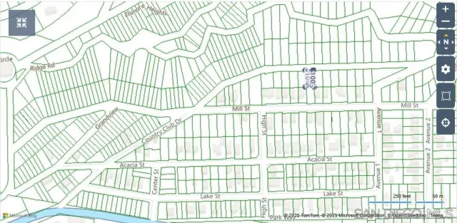 en suite bathroom with a window and wooden floor