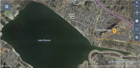 a water fountain in middle of a forest