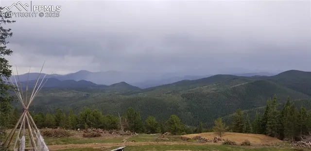 a view of a town with mountains in the background