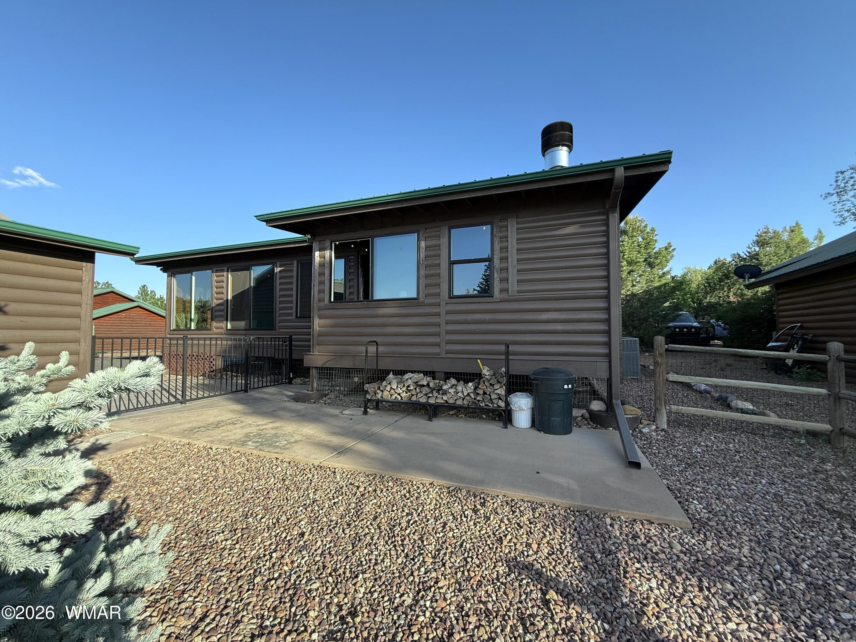 2334 Buffalo Loop Overgaard, AZ 85933 - Photo 15 of 25 a view of a house with a patio