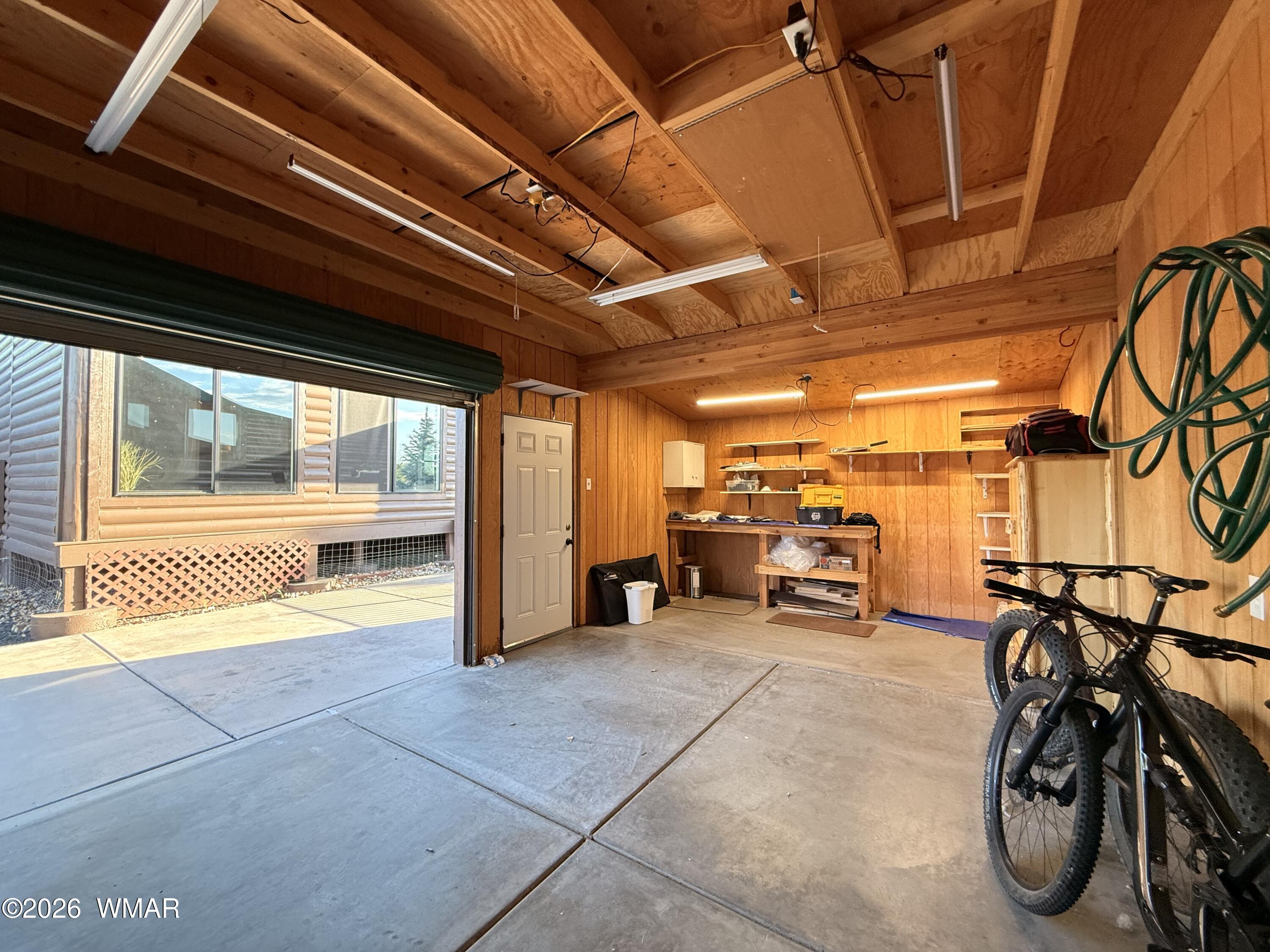 2334 Buffalo Loop Overgaard, AZ 85933 - Photo 21 of 25 a view of a room with gym equipment