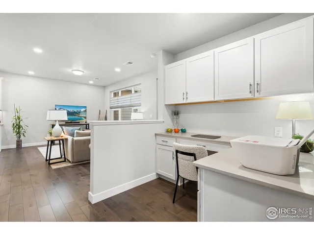 a kitchen with a cabinets and wooden floor