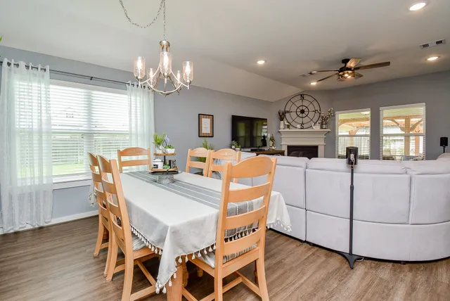 a kitchen with stainless steel appliances granite countertop a sink dishwasher and cabinets with wooden floor