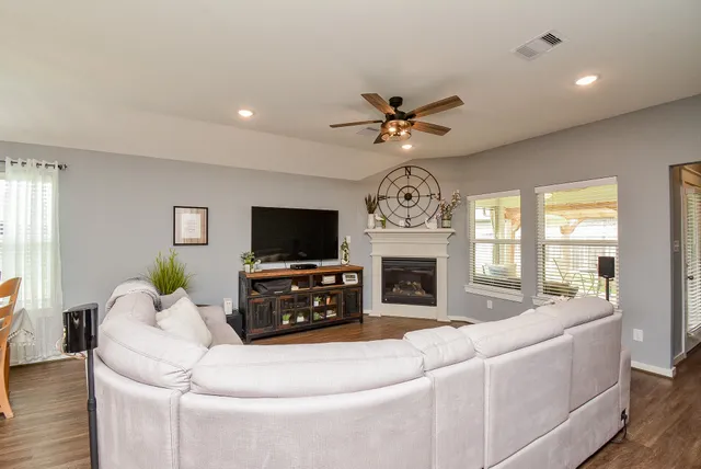 a room with furniture and a flat screen tv
