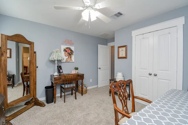 a view of a patio with a table chairs and a backyard