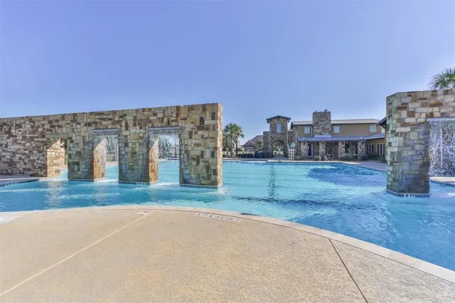 a view of a park with swings and slides