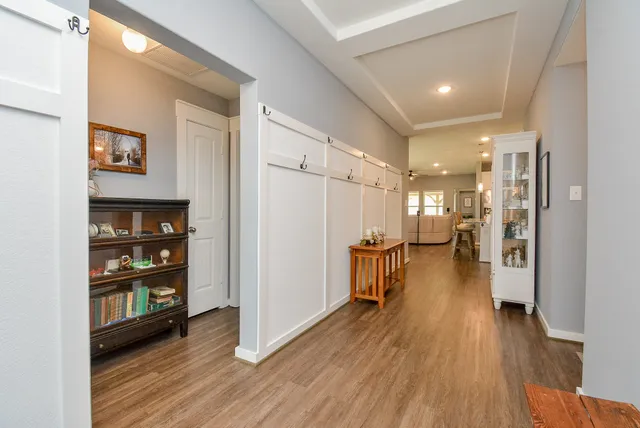 a kitchen with sink a microwave and cabinets