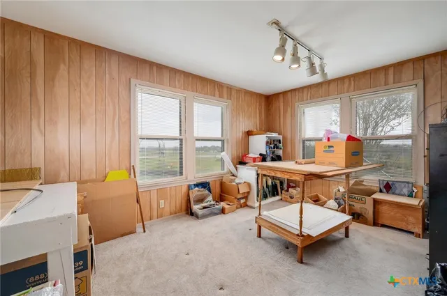 a workspace with pool table and windows