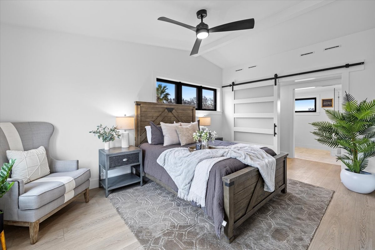 2406 West 10th Street, Unit A Austin, TX 78703 - Photo 5 of 13 a bed room with a bed and a couch