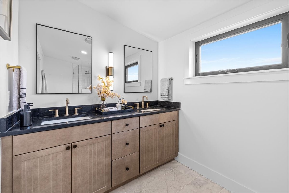 2406 West 10th Street, Unit A Austin, TX 78703 - Photo 6 of 13 a bathroom with a sink and a mirror