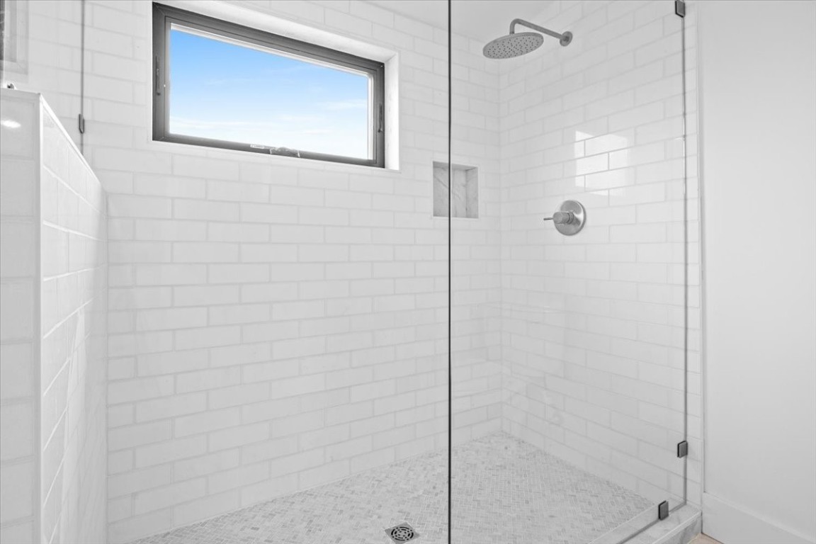 2406 West 10th Street, Unit A Austin, TX 78703 - Photo 7 of 13 a bathroom with a shower