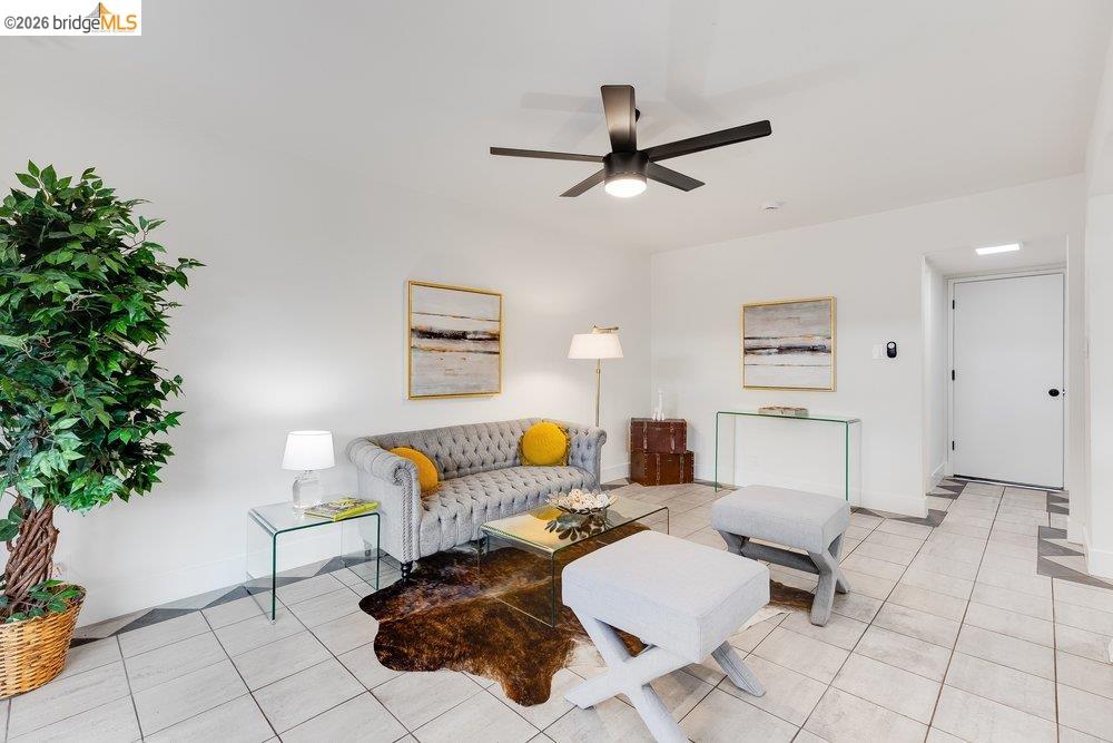 1298 Ribbon Street Foster City, CA 94404 - Photo 37 of 86 Spacious living area featuring light-toned tile flooring with geometric accents, a contemporary ceiling fan, and white walls