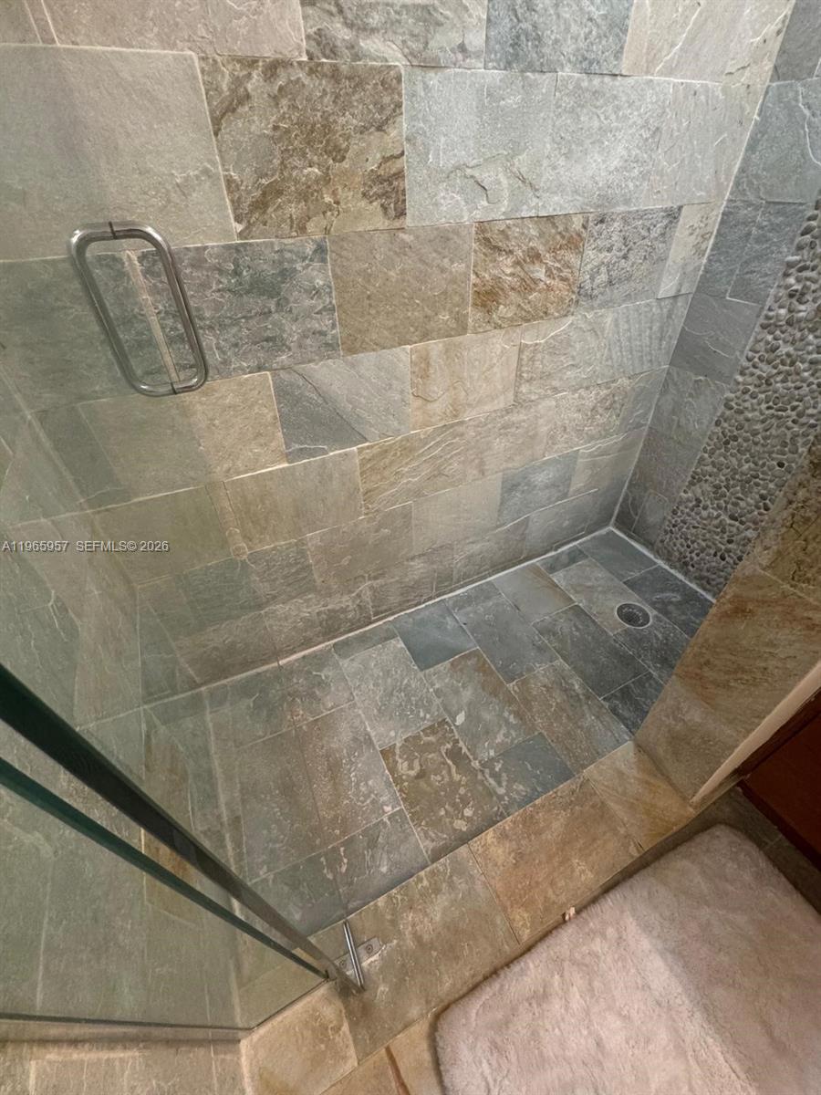 2681 North Flamingo Road, Unit 2302S Sunrise, FL 33323 - Photo 11 of 25 a bathroom with a shower