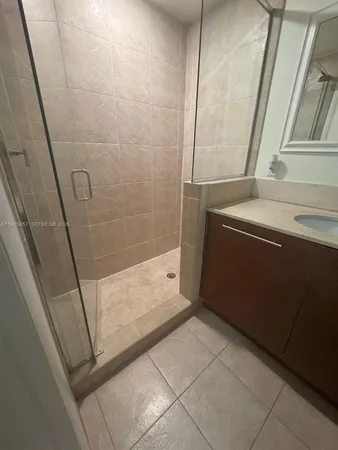 a bathroom with a bathtub and shower