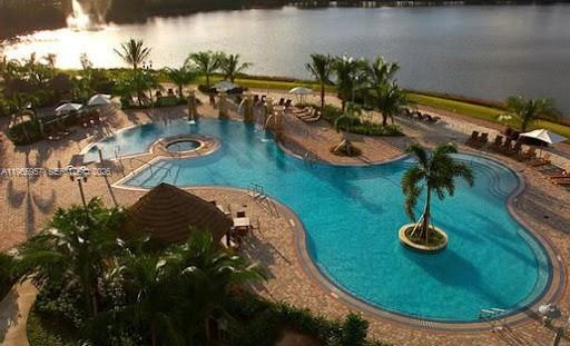 2681 North Flamingo Road, Unit 2302S Sunrise, FL 33323 - Photo 19 of 25 a view of a lake with outdoor space