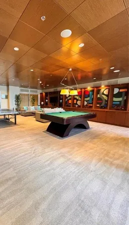 a view of a building with cars parked